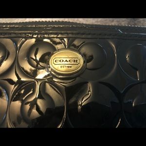 Coach black patent leather wristlet.